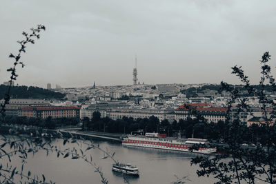 View of bridge over river against buildings in city