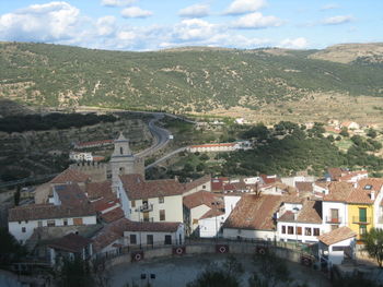 High angle view of town against cloudy sky