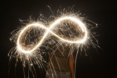 Person playing with sparkler