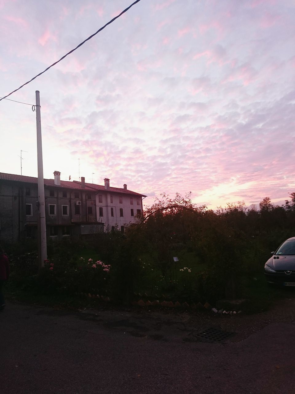 building exterior, architecture, sky, built structure, sunset, cloud - sky, road, street, tree, transportation, cloud, house, cloudy, residential structure, outdoors, city, the way forward, no people, residential building, nature