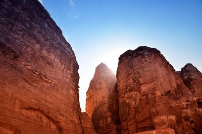 Low angle view of rock formations against sky
