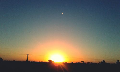 Silhouette landscape against sky during sunset