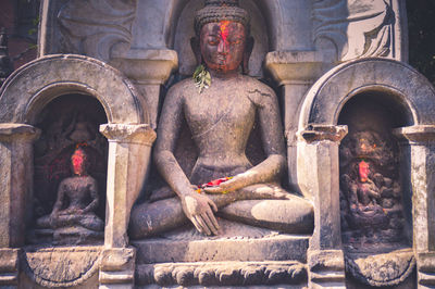 Statue of buddha outside building