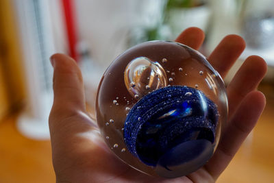 Close-up of hand holding ice cream