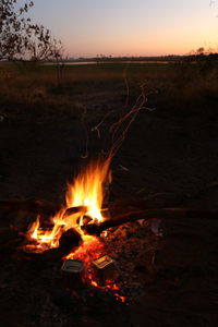 Bonfire against sky at sunset
