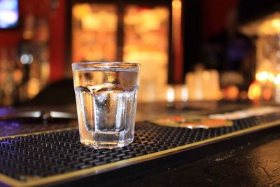 Close-up of served tequila glasses on table