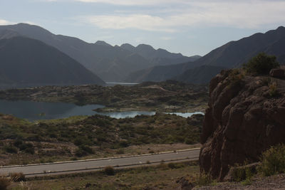 Scenic view of landscape and mountains against sky