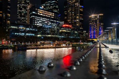 Illuminated buildings in city at night