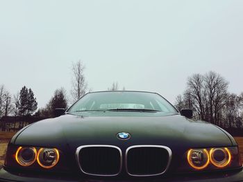 Wet car against clear sky