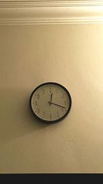 Close-up of clock on wall