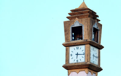 Low angle view of clock tower against sky