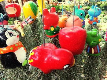 Close-up of red and animal representation on grass