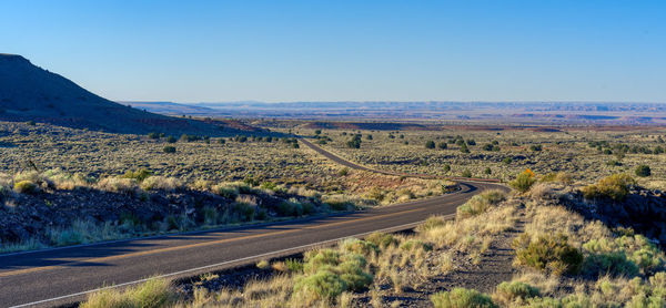 Scenic view of landscape against clear blue sky