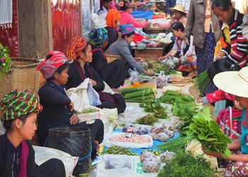 People at market stall