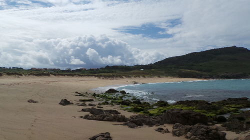 Scenic view of sea against cloudy sky