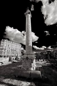 Low angle view of old building against cloudy sky