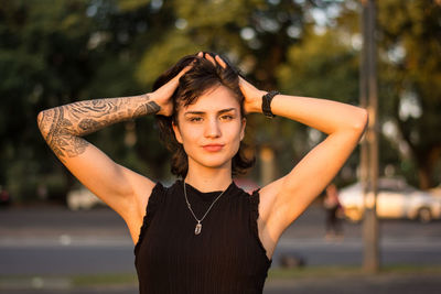 Portrait of young woman standing outdoors