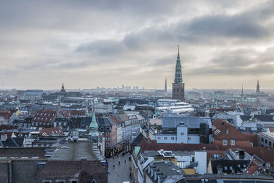 High angle view of cityscape against cloudy sky