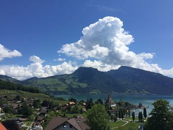 Panoramic view of trees and buildings against sky