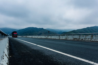 Road against cloudy sky