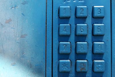 Close-up of buttons on pay phone