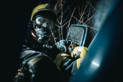 Low section of man standing in car