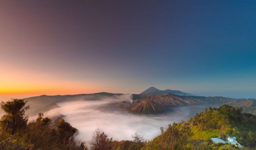 Scenic view of mountains against sky during sunset