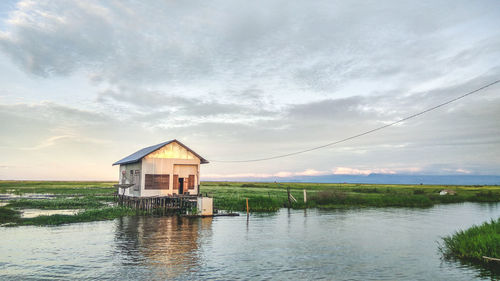 Built structure on sea against sky