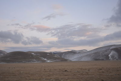 Scenic view of beach against sky during sunset