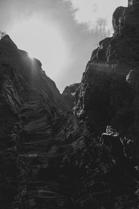 Low angle view of rock formations against sky