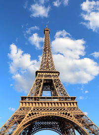 Fantastic eiffel tower with blue sky and white clouds in vertical