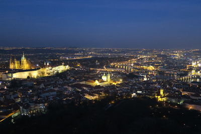 Aerial view of illuminated cityscape at night