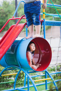 Kids playing on play equipment at park