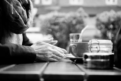 Close-up of hand holding cigarette