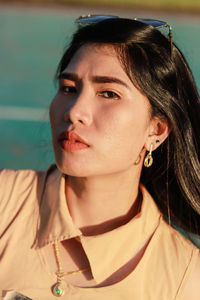 Close-up portrait of a young woman looking away