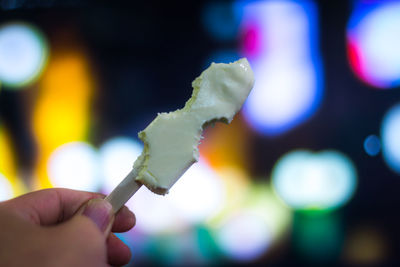 Close-up of hand holding ice cream