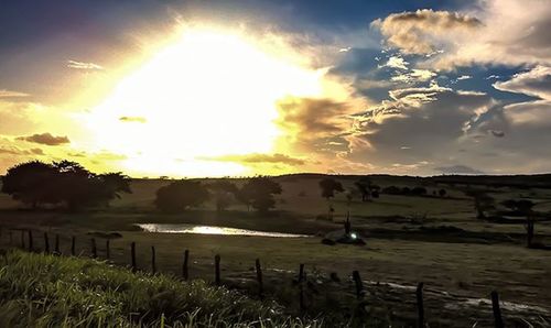 Scenic view of landscape against cloudy sky