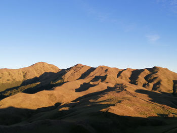 Scenic view of rocky mountains against clear sky