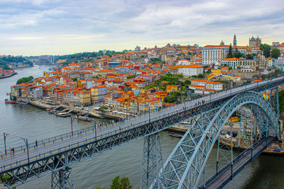 High angle view of porto bridge over river in city against sky