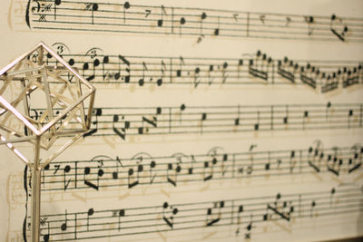 High angle view of music notes on paper