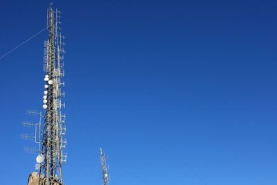 Communication, telecommunication and television antennas, positioned between the rocks 