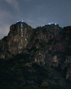 Low angle view of rock formations against sky