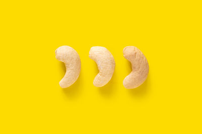 Directly above shot of cookies against yellow background