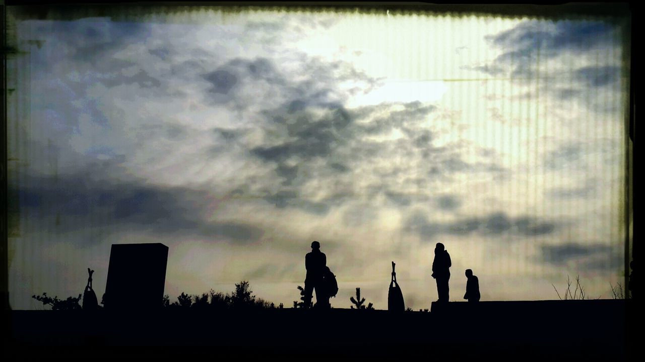 silhouette, sky, cloud - sky, men, transfer print, sunset, lifestyles, togetherness, cloudy, auto post production filter, outline, dusk, cloud, person, leisure activity, standing, weather, built structure