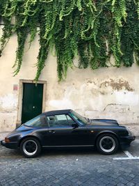 Vintage car parked on street in city