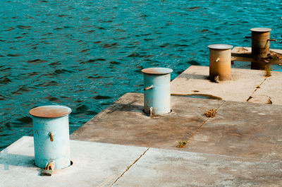 High angle view of garbage bin by sea