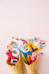 Close-up of multi colored candies against white background