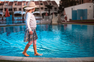 Full length of child at swimming pool