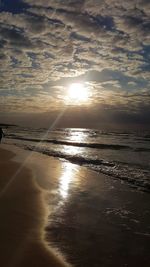 Scenic view of beach against sky during sunset