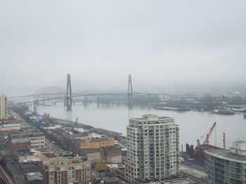 High angle view of bridge and buildings against sky in new westminster 